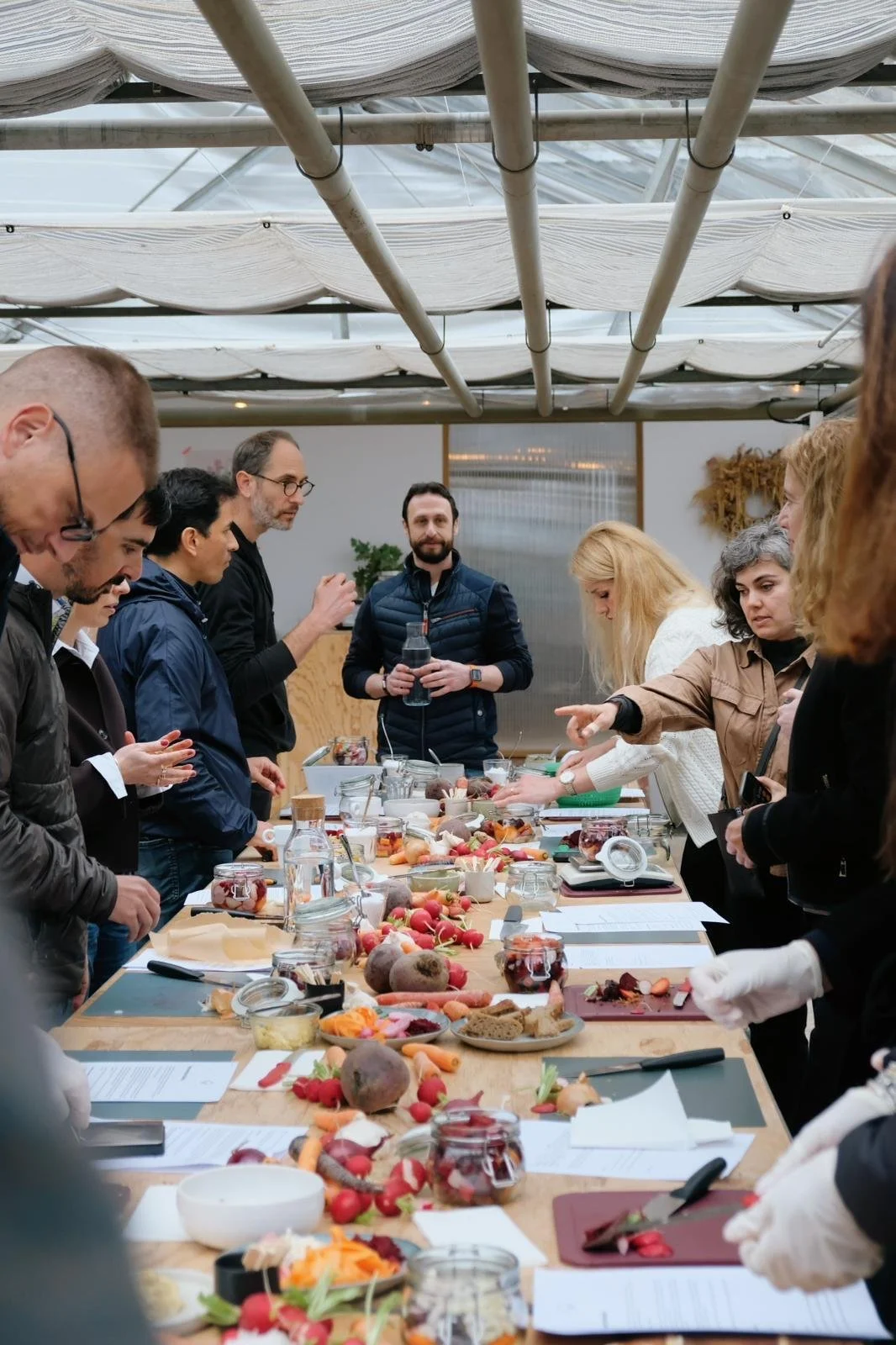 Participants gathered around the fermentation workshop table